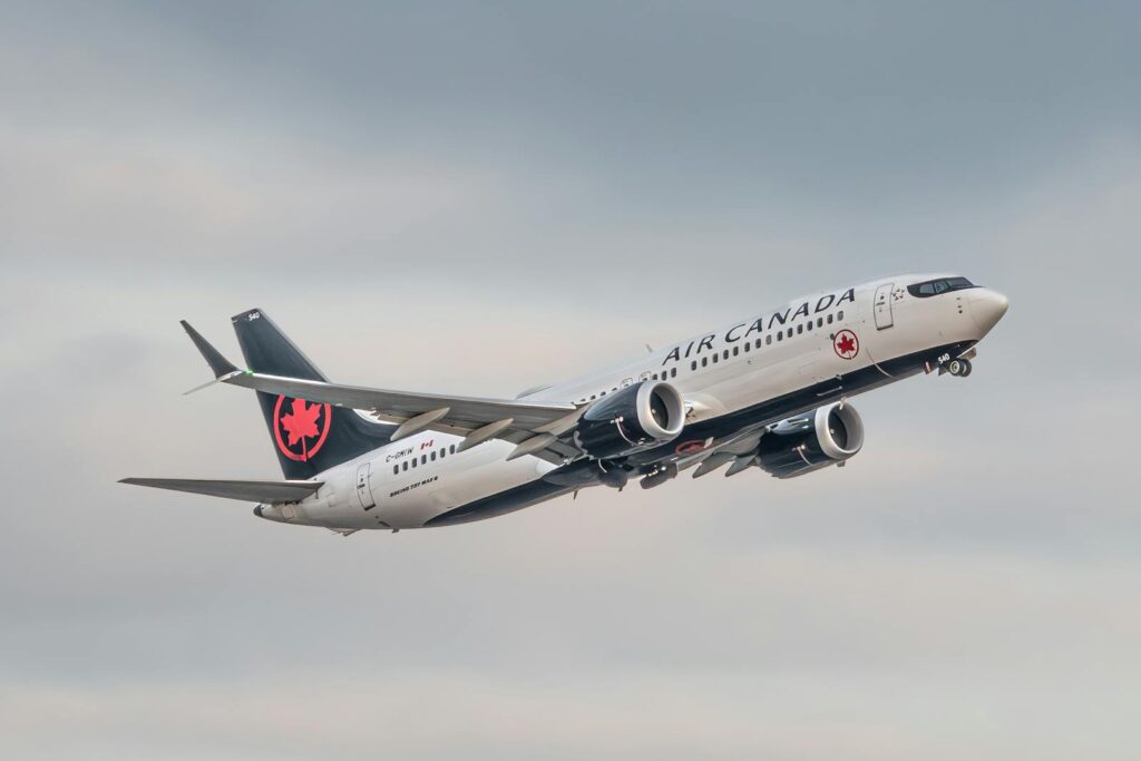 Air Canada Boeing 737 Max takes to the sky, showcasing flight and travel.